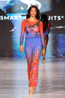 This text promotes sustainable tan-through smart swimsuits featuring the elegant Lily print. It highlights a one-piece swimsuit with sleeves, emphasizing sophistication and timeless elegance. Users are encouraged to shop now to elevate their feminine style.