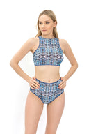 Explore our file featuring Tan Through Smart Swimsuits in a Tie-Dye print. With high waist bikini bottoms, it offers a perfect fit and SPF35 protection. Timeless style meets innovative sustainability