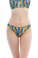 This file showcases sustainable smart swimsuits featuring a stylish feather print. With tan-through fabric and SPF 35 protection, it highlights a classic bikini design, catering to eco-conscious individuals.