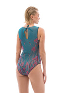 This file showcases innovative sustainable tan-through smart swimsuits adorned with the elegant Swans print. Featuring a sleeveless one-piece design, it exudes signature sophistication.