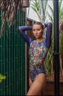 Discover sustainable and chic tan-through smart swimsuits with a snake print design. Sleeveless and SPF35 protected, they offer classic luxury. Limited-time sale available.