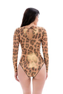 This file features sustainable tan-through smart swimsuits adorned with the iconic leopard print. With a one-piece swimsuit design including sleeves, it offers chic silhouettes for sophisticated beach style