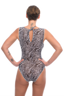 Explore sustainable tan-through smart swimsuits adorned with a trendy Fake Zebra print in this file. Featuring sleeveless one-piece designs, they offer both style and sun protection.