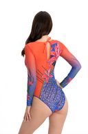 This text promotes sustainable tan-through smart swimsuits featuring an elegant Lily print. It highlights a one-piece swimsuit with sleeves, offering sophistication and timeless elegance. Users are encouraged to shop now to elevate their feminine style.